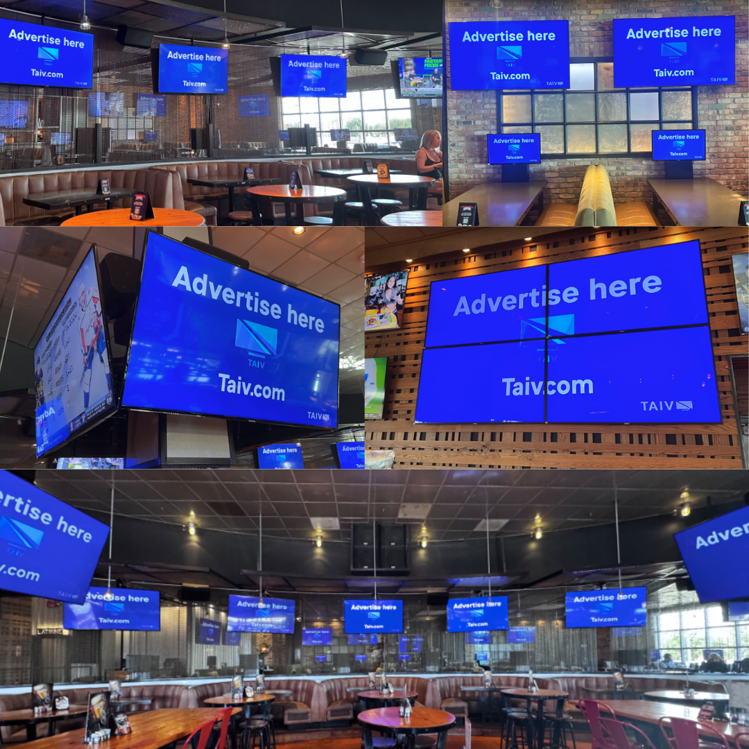 Venue advertising displayed on multiple screens inside a bar or restaurant